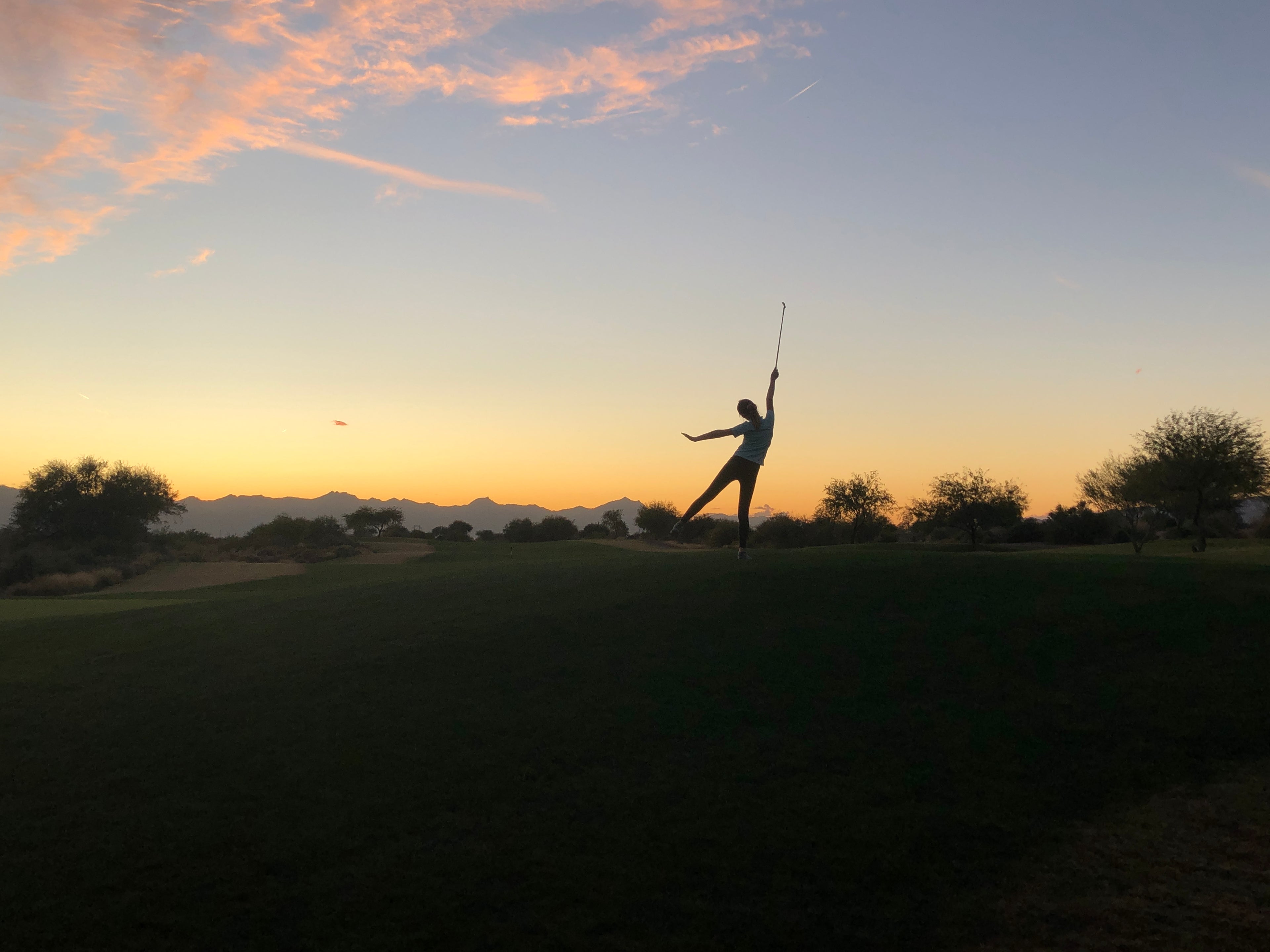 Child Golfer At Sunset